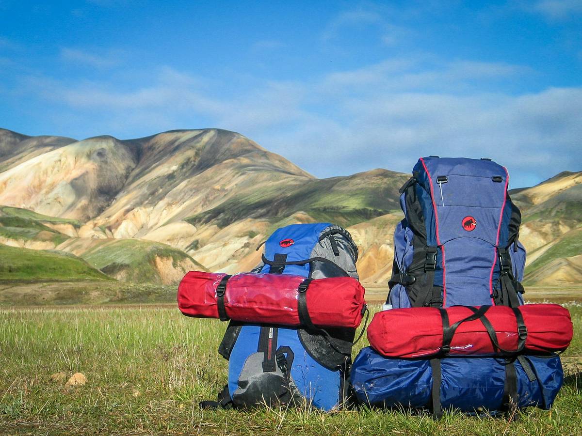 Hiker wearing high-performance downpour gear rain protection should you trust in heavy rain
